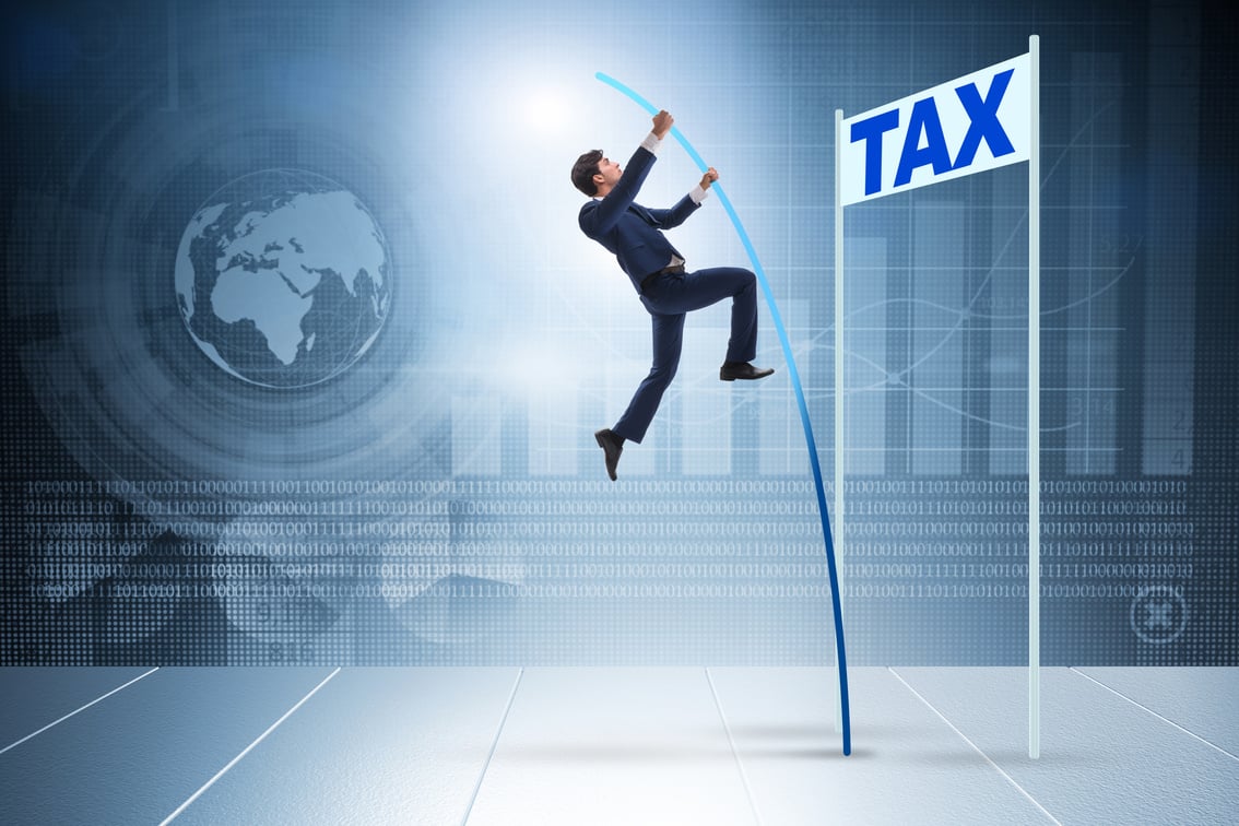 Businessman Jumping over Tax in Tax Evasion Avoidance Concept